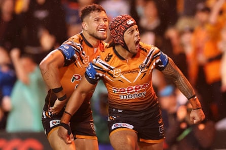 Jarome Luai celebrates scoring a try for the Wests Tigers against the Gold Coast Titans