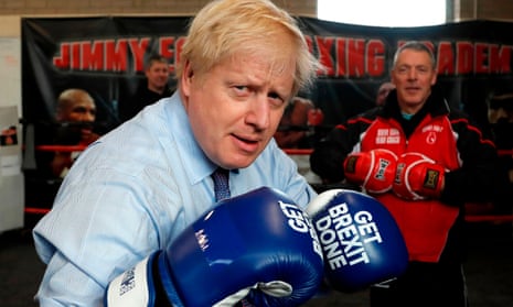 Boris Johnson wears boxing gloves emblazoned with “Get Brexit Done”