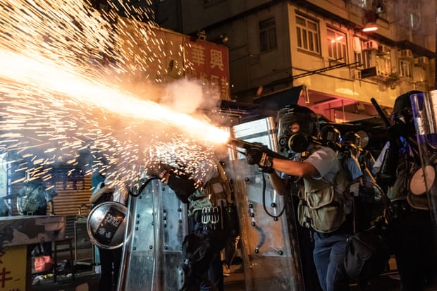 Police fire teargas to clear pro-democracy protesters during a demonstration on Hungry Ghost festival day in the Sham Shui Po district.