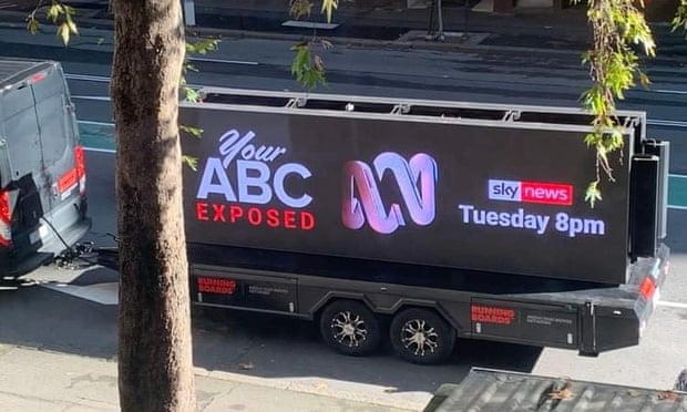 A truck towing a billboard with an ad for the Your ABC Exposed program drives down a street in Sydney