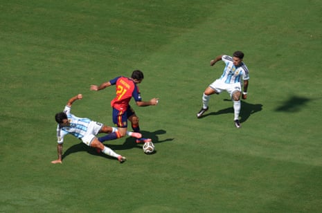 Leandro Paredes gets stuck in straight away on Mikel Oyarzabal.