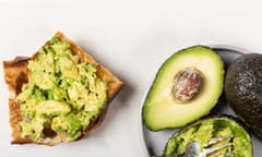 Pieces of toasted white sourdough bread with fresh ripe avocado