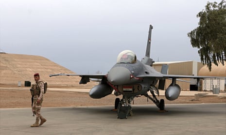 An Iraqi army soldier stands guard near a US-made Iraqi air force F-16 fighter jet at the Balad airbase.