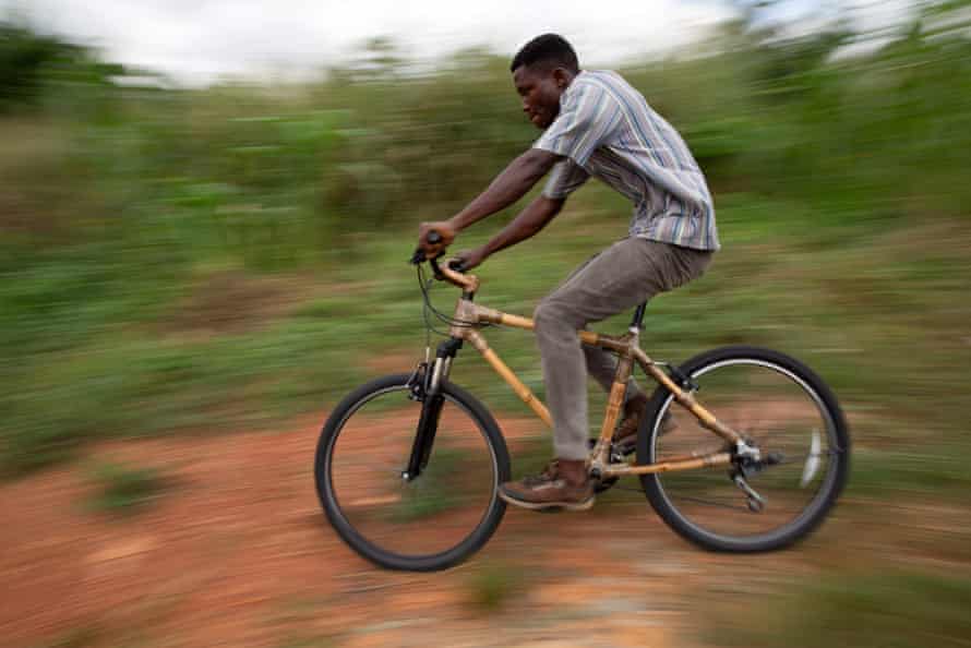 Clement Adade rides one of the bamboo bicycles.