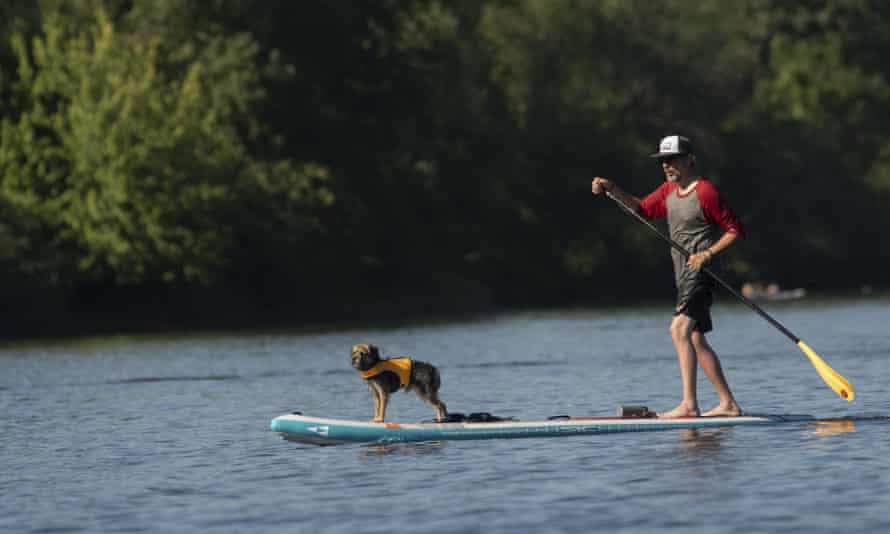 A man in Portland cools off on the Willamette river as temperatures soared to an all-time high for the area.