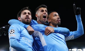 Gabriel Jesus (right) celebrates with teammates Bernardo Silva (left) and Joao Cancelo after scoring Manchester City’s second goal.