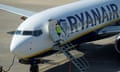 FILE PHOTO: A Ryanair Boeing 737 plane at Valencia airport<br>FILE PHOTO: Ground staff enter a Ryanair Boeing 737-800 plane a day before a cabin crew strike to be held in four European countries on July 25 and 26, in Valencia, Spain, July 24, 2018. REUTERS/Heino Kalis/File Photo
