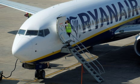 Ground staff work on a Ryanair Boeing 737