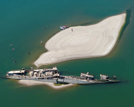 A warship near an exposed sandbank