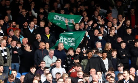 Newcastle United fans with Saudi Arabia flags before their game at Crystal Palace in October 2021