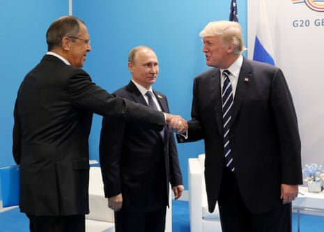US president Donald Trump, right, greets Russian foreign minister Sergey Lavrov, left, before talks with Vladimir Putin, centre, during the G20 summit in Hamburg Germany in July 7, 2017.