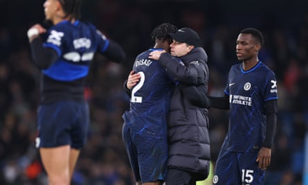 Mauricio Pochettino hugs Axel Disasi after Chelsea’s draw at Manchester City.