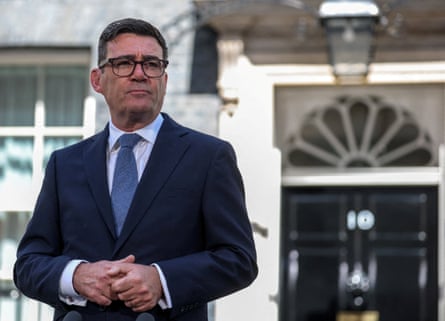 Andy Burnham standing outside the black door to 10 Downing Street