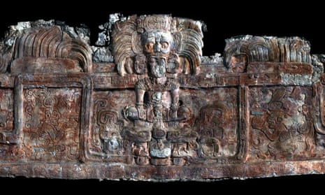 A 3D scan of the frieze decorating a tomb-containing building at Holmul, showing a king wearing an avian sun god headdress emerging from a sacred mountain spirit head amid feathered serpents.