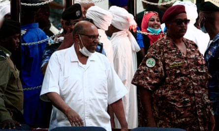 Sudan’s former president Omar al-Bashir (centre-left) during his trial in the capital, Khartoum, on 3 November.