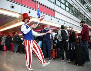 Travellers queue to check into Virgin Atlantic and Delta Air Lines flights at Heathrow Airport Terminal 3, following the lifting of restrictions on the entry of non-US citizens to the United States.