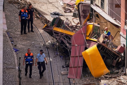 Police officers inspect the wreckage of the derailed streetcar.