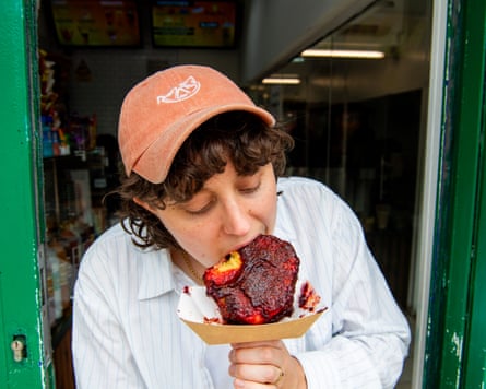 Lucy tucking into a Pine Pop – pineapple coated with homemade chamoy.