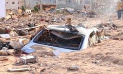 A damaged vehicle stuck in debris after the floods caused by Storm Daniel ravaged Derna, Libya.