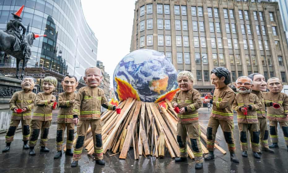 Cop26 - Glasgow<br>PABest Campaigners wearing 'big heads' of world leaders, including Boris Johnson, Joe Biden, Justin Trudeau and Narendra Modi gather for Oxfam's 'Ineffective Fire-Fighting World Leaders' protest performance in front of a 10 foot globe with a simulated bonfire, during the official final day of the Cop26 summit in Glasgow. Picture date: Friday November 12, 2021. PA Photo. See PA story ENVIRONMENT Cop26. Photo credit should read: Jane Barlow/PA Wire