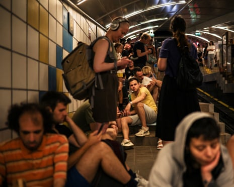 People take cover inside a cable car tunnel at Haifa, Israel.