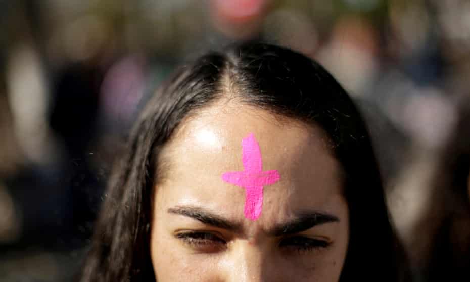 A woman with a pink cross on his forehead takes part in a protest to demand justice for Isabel Cabanillas, an activist for women rights whose body was found last Saturday, in Ciudad Juarez, Mexico January 19, 2020. 
