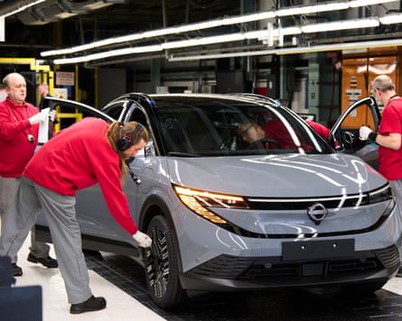 A new electric Leaf car comes off the production line at the Nissan factory at Sunderland