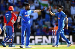 Hardik Pandya (left) and Yuzvendra Chahal of India celebrate the wicket of Najibullah Zadran of Afghanistan.