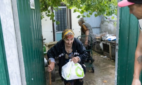 Red Cross members evacuate civilians are evacuated from the frontline villages to a temporary shelter in Kupiansk, Kharkiv oblast.