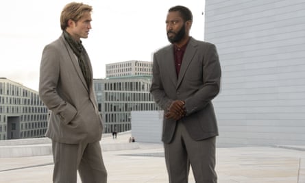 This image released by Warner Bros. Entertainment shows Robert Pattinson, left, and John David Washington in a scene from “Tenet.” Warner Bros. says it is delaying the release of Christopher Nolan’s sci-fi thriller “Tenet” until Aug. 12. (Melinda Sue Gordon/Warner Bros. Entertainment via AP)
