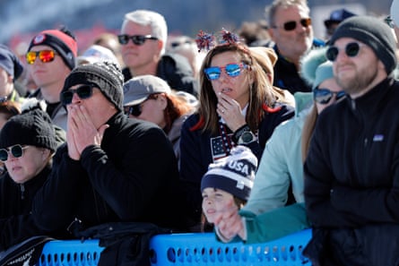 American fans watch the big screen in shock as Lindsey Vonn crashes during the women’s downhill