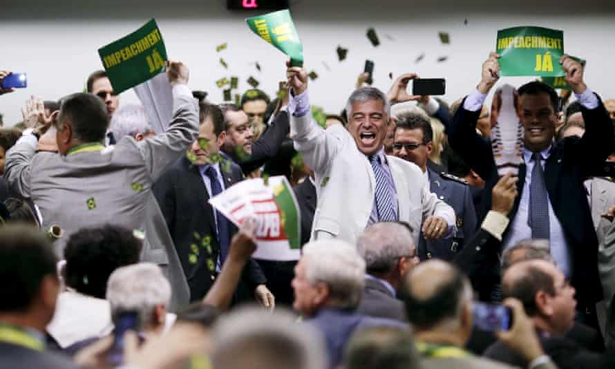 Members of the impeachment committee celebrate after voting on the impeachment of Brazilian President Dilma Rousseff Monday in Brasilia.
