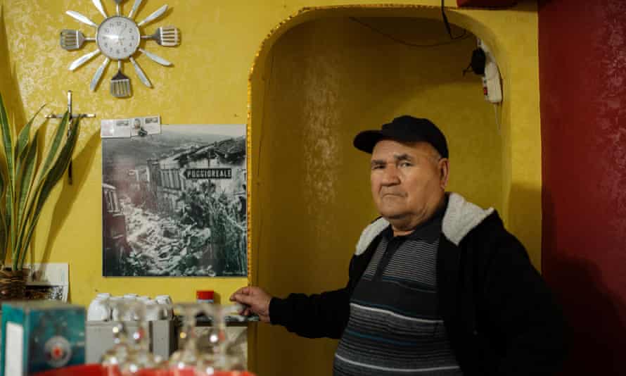 Calogero Petralia, 68, shows a picture of Poggioreale after the earthquake, which struck when he was 18. He now lives in Poggioreale Nuova.