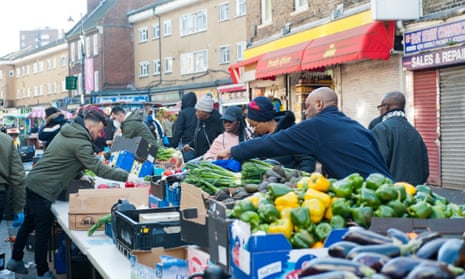 East Street Market, Walworth, south London: shopping continues despite the lockdown.
