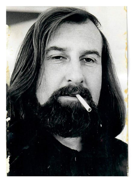 A bearded Neil Stokoe smoking