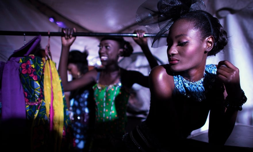Models wait backstage during Dakar fashion week.