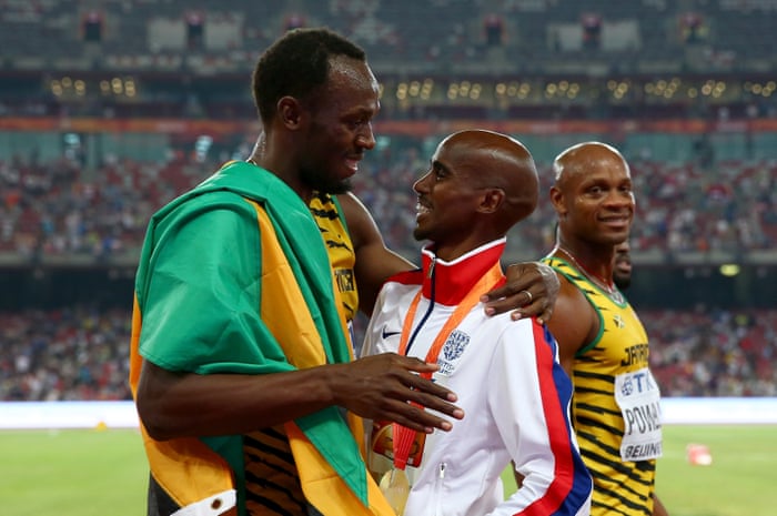 Then gets a congratulatory hug from Usain Bolt