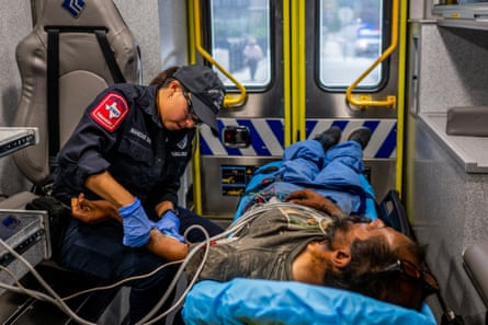 A dehydrated person receives medical care in an an ambulance.