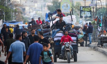 Displaced Palestinians flee Rafah with their belongings to safer areas in the southern Gaza Strip.