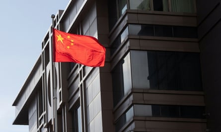 China’s national flag is seen waving at the China Consulate General in Houston, Texas, U.S