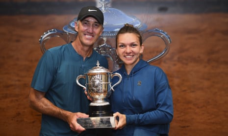 Simona Halep poses with her coach Darren Cahill and the French Open trophy
