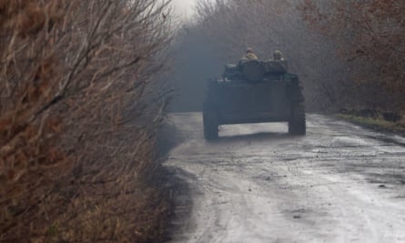 A Ukrainian armoured vehicle on a road near the frontline in Donetsk region