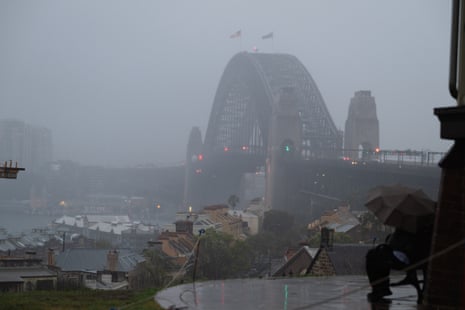 Sydney Harbour Bridge covered in fog