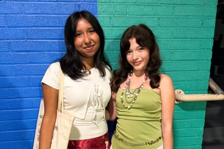 two girls smile together