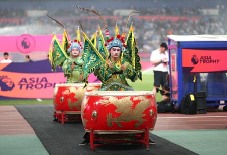 A drummer performs prior to the Premier League Asia Trophy match between West Ham United and Manchester City at the Nanjing Olympic Sports Center Gymnasium in July2019.