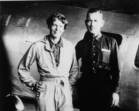 Amelia Earhart and her navigator Fred Noonan, in front of their aircraft