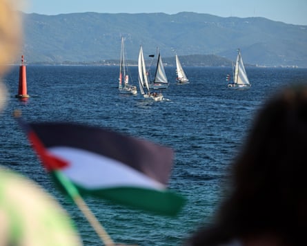 Activists wave palestinian flags as a flotilla leaves carrying humanitarian aid and activists vowing to try ‘to break the siege of Gaza’.