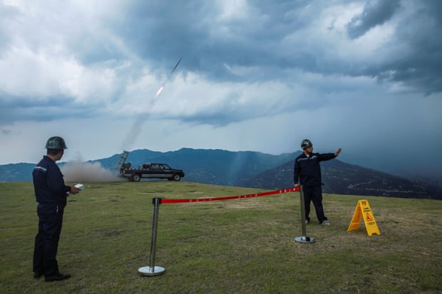 Staff carry out artificial rain seeding operations as part of the drought relief measures in Zigui county of Yichang, Hubei province.