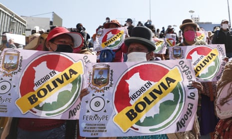 Demonstrators wearing masks amid the new coronavirus pandemic protest demanding that the government authorize the reopening of small businesses, in La Paz, Bolivia, Wednesday, June 17, 2020. (AP Photo/Juan Karita)