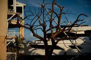 A boat is seen washed up next to a building after Hurricane Dorian on September 5, 2019, in Marsh Harbor, Great Abaco, Bahamas. - The death toll from Hurricane Dorian has risen to 30 in the Bahamas, Prime Minister Hubert Minnis told American network CNN on Thursday. Authorities had previously reported 20 dead, but have warned that the final figure is sure to be far higher.